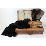 A lady's three quarter length black fur coat, three fur stoles, an evening bag,