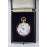 An 18k lady's fob watch, the white enamel dial with black Roman numerals and gilt detail,