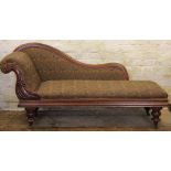 A Victorian carved mahogany chaise longue, with scroll back and floral upholstery,