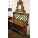 A Victorian ash wash stand, the raised back set with a mirror and tiles decorated with sweet peas,