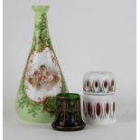 A tapering glass vase decorated with putti, against a green ground, 26cm high,