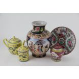 A modern Chinese teapot and cover and matching mug and cover,