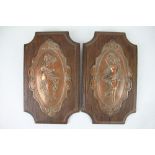 A pair of late 19th century French copper plaques, embossed with nymphs, on oak backplates,