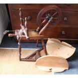 A 19th century oak spinning wheel,