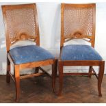 A modern burr walnut extending dining table, with inlaid top with a moulded edge, on cabriole legs,