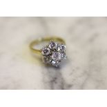 A seven stone diamond cluster ring,