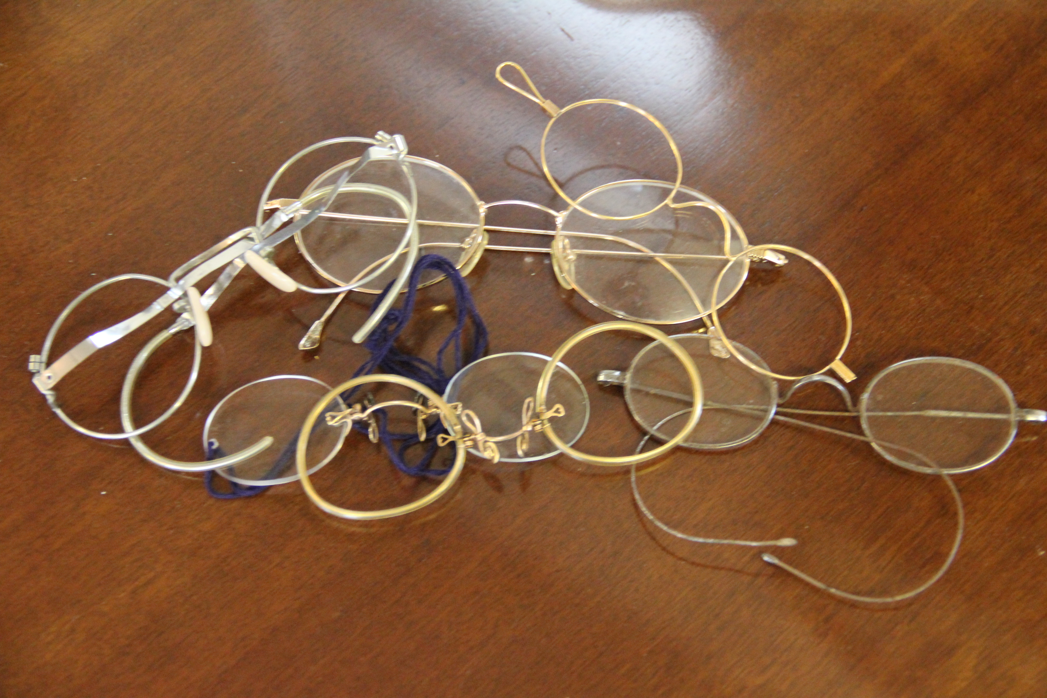 A collection of six pince nez and spectacles to include gold plated examples (6)