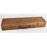 A pine gun case, with compartmented interior and leather handle,