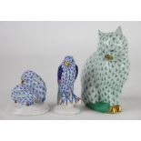 Three Herend animals, to include; a seated cat in green 11cm high, two rabbits in blue 5.