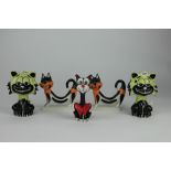 Five Lorna Bailey model cats, comprising two pairs and one seated long neck cat,