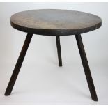 An 18th century oak cricket table, of primitive form,