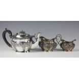 An Edwardian silver three piece tea service, Joseph Gloster Ltd, Birmingham 1907,