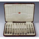 An Edwardian cased set of six silver desert knives and forks, Thomas Bradbury and Sons Ltd,