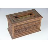 An Edwardian carved walnut letters box, with brass inset hinged lid and moulded base,