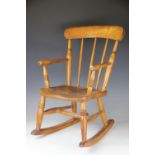 A 19th century beech and ash childs rocking chair,