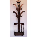 A Victorian mahogany hall stand, with oval umbrella stand base, with turned uprights and feet,