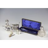 A collection of silver to include; a silver topped glass scent bottle, 8cm high,