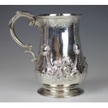 A Victorian silver christening mug, with repousse floral decoration, William Evans, London 1865,