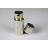 An Asprey's silver pill dispenser, London 1908, of cylindrical form and with screw cover,