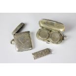 A late 19th century silver double sovereign case, Birmingham 1898, a silver vesta case,