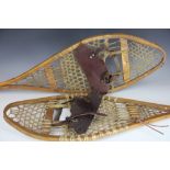 A pair of ash, leather and vellum snow shoes,