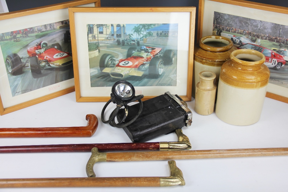 Four walking sticks, three stoneware vessels, a brass magazine rack,