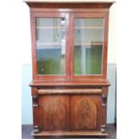 A Victorian mahogany bookcase cabinet, with two glazed doors enclosing shelves,