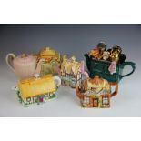 A collection of novelty teapots, to include cottage ware examples, a Police Box, a cooking range,