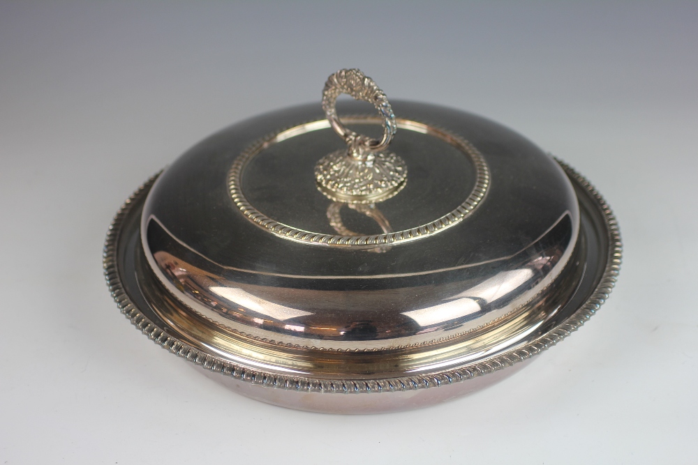 A late 19th century large circular serving dish and cover, with three section divider inside,