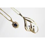 A sapphire and diamond oval cluster pendant and chain set in 18ct yellow gold, weight 3.
