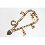 A 9ct gold curb link charm bracelet and heart shaped locket clasp,