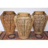 Three tall vase shaped wicker baskets, 68cm,