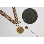 A gold Edward VII half sovereign dated 1906, pierced and suspended from a yellow metal bracelet,