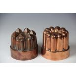 Two 19th century copper jelly moulds by Benham & Froud, one with rounded detailing and numbered 501,