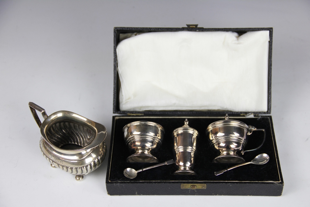 A George VI cased silver three piece condiment set and tea spoons, Roberts & Dore, Birmingham 1947,