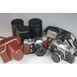 A Canon FX camera, 340585, with a 50mm lens 759946, a Canon 85mm lens 19726,