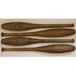 A set of four early 20th century stained pine exercise clubs, with turned handles,