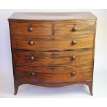 A Regency mahogany bow front chest, of two short and three long drawers, on splayed bracket feet,