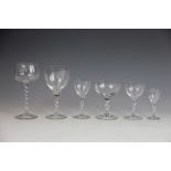 A part suite of glass ware, each piece with barley twist stem, comprising; eleven champagne bowls,