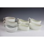 Seven assorted white glazed bourdalou, to include a French example 26cm wide,