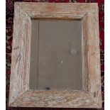 A modern rustic pine wall mirror, 64cm x 53cm, with another pine wall mirror,