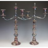 A pair of late Victorian silver plated three branch candelabra,