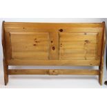 A modern waxed pine double sleigh bed,