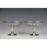 A near pair of Edwardian silver bon bon dishes, Birmingham 1909, A & J Zimmerman and Elkington & Co,