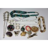 A collection of jewellery to include; bead necklaces and brooches including two 'Miracle' examples,