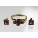 A pair of ruby and diamond stud earrings and a tourmaline and diamond ring