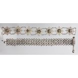 An Indian white metal bracelet, designed as seven cobwebs,