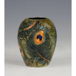 A Moorcroft vase, tube lined in a peacock feather design, signed in gilt 'J Moorcroft 25.04.