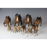 A collection of Beswick horses, to include two shire horses and foal, two other Beswick horses,