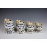 A graduated set of four earl 19th century Ironstone China hexagonal jugs,